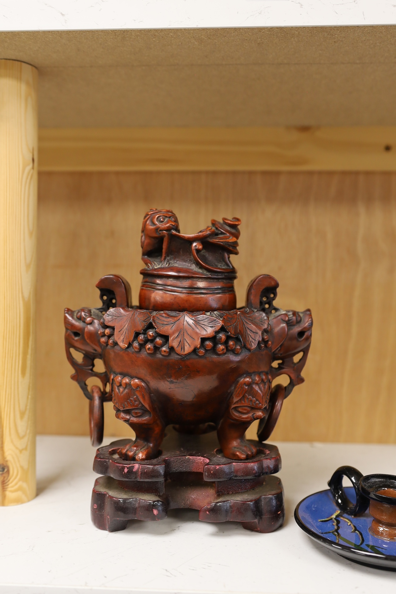 A Chinese composition tripod censer and cover, wood stand, 22.5cm high. Condition - fair